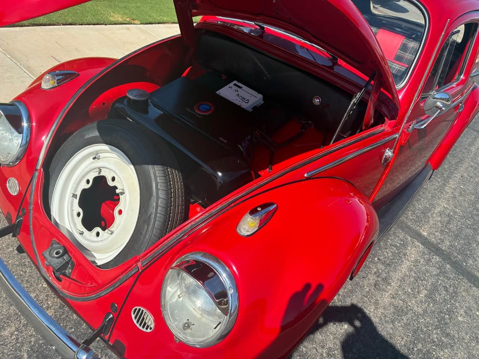 Front trunk open with spare tire