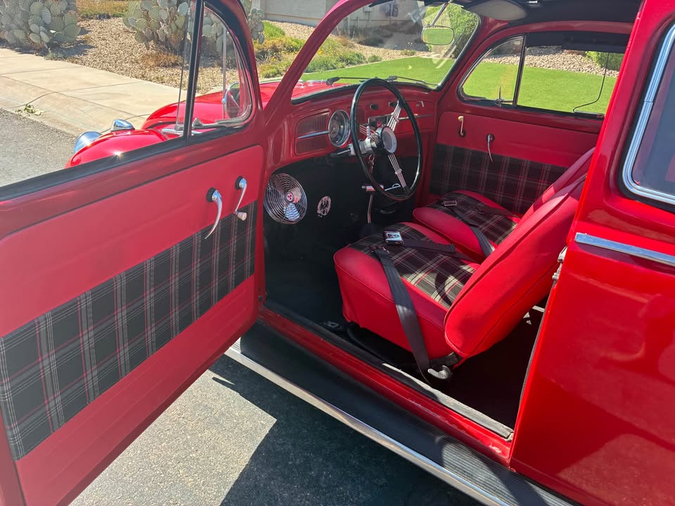 Interior through driver door, plaid upholstery