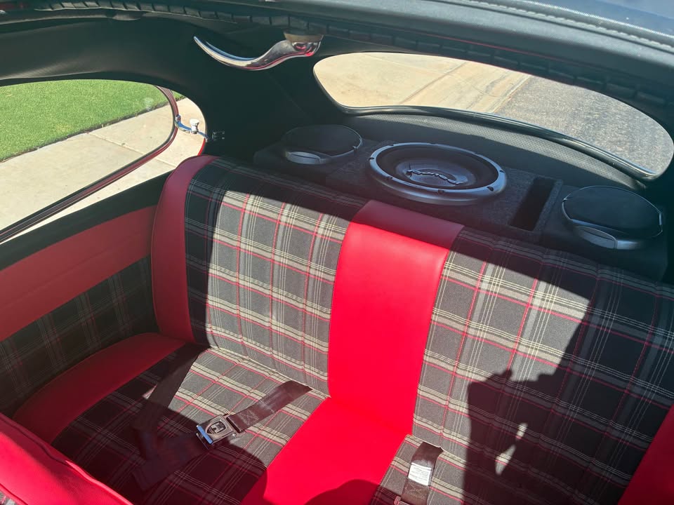 Back seat with stereo speakers and subwoofer