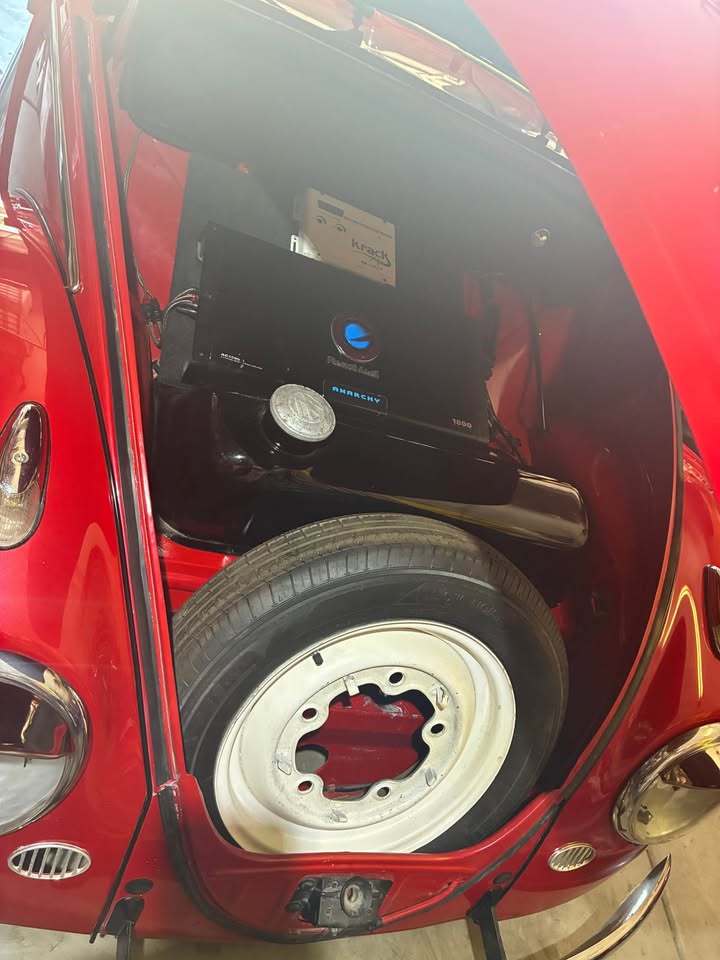 Trunk with spare tire and amplifiers
